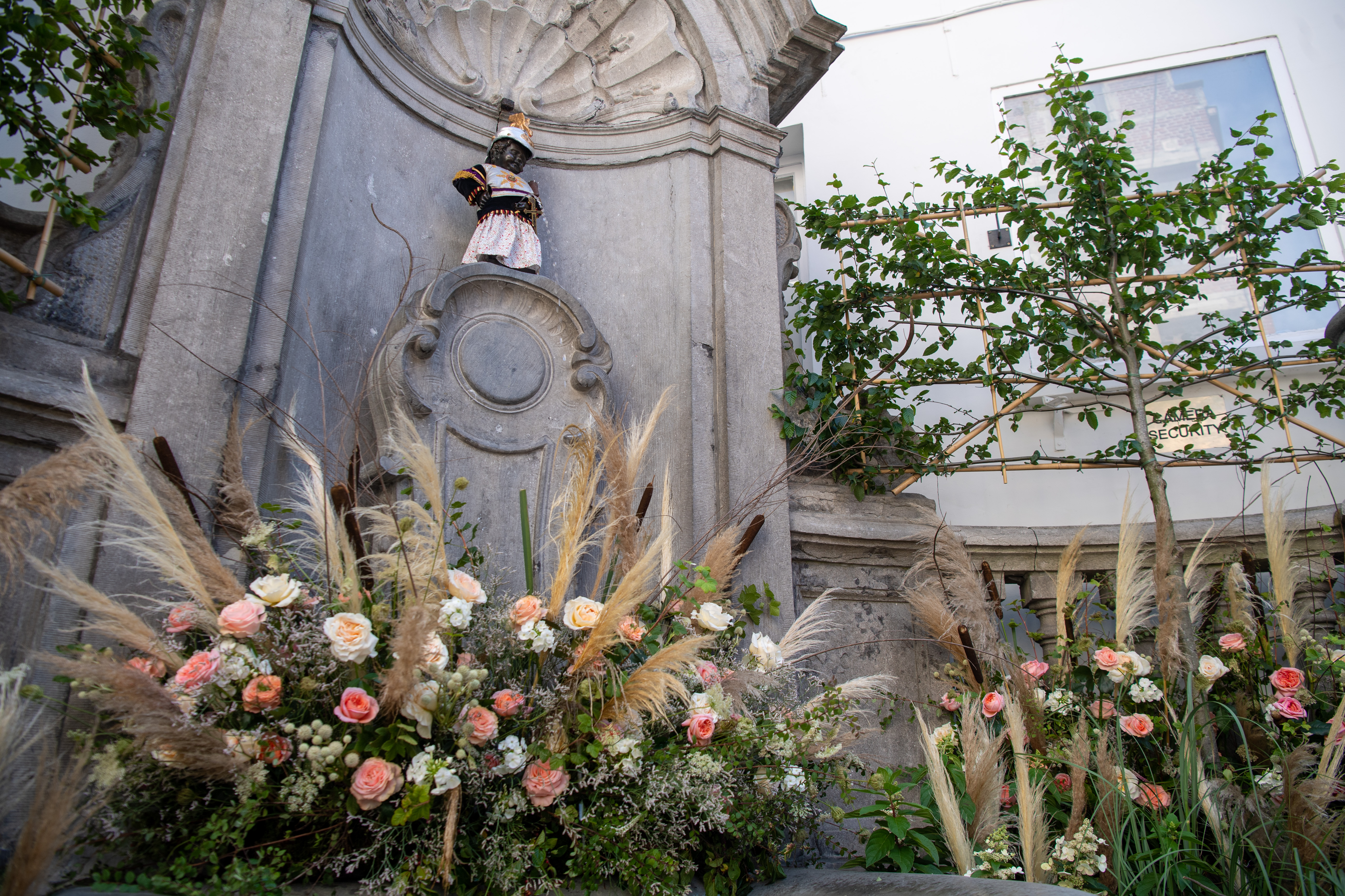 The Manneken-Pis surrounded with flowers